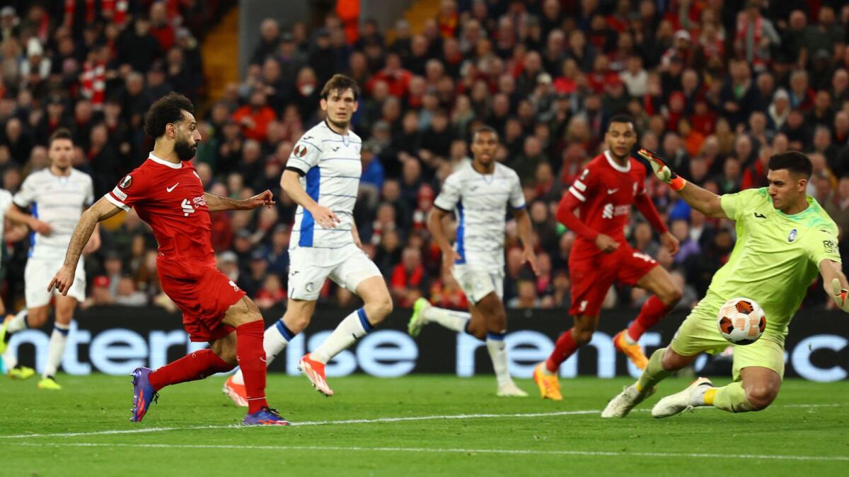 Liverpool's Mohamed Salah scores their first goal before it is disallowed. - Reuters