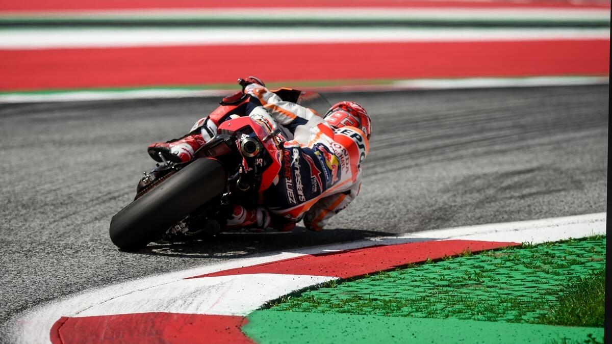Marquez claims landmark MotoGP pole in style with record lap