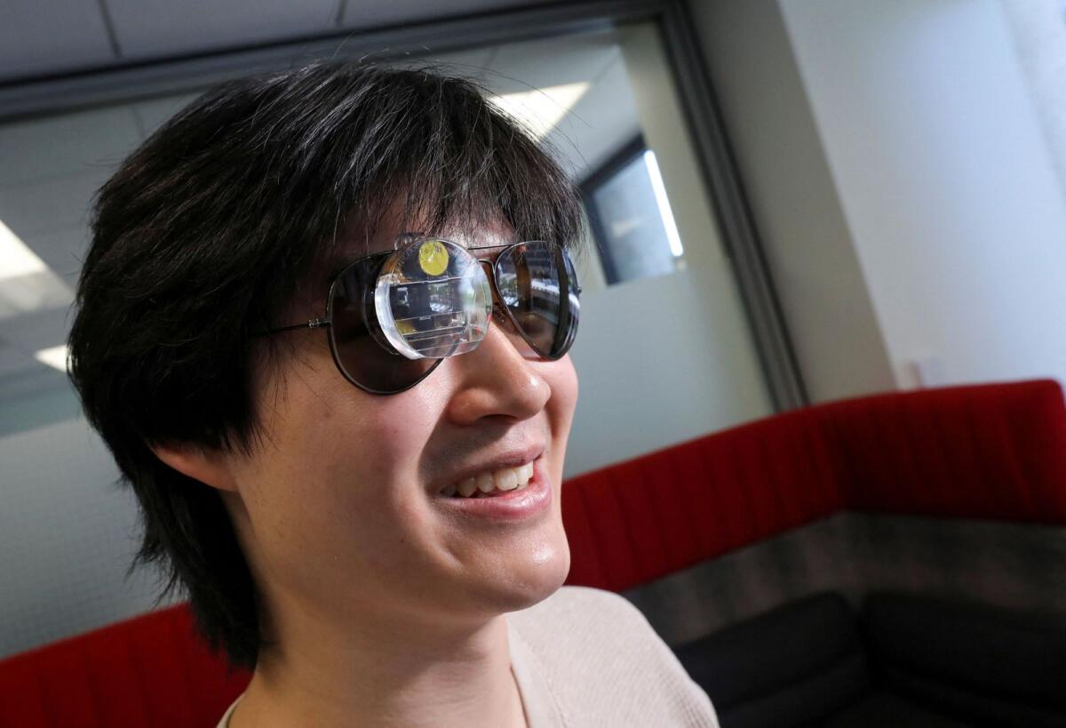 Bryan Chiang, a 22-year-old computer science major and aspiring start-up creator, wears an augmented reality eyepiece equipped with RizzGPT in San Francisco, California, on May 11, 2023. Photo: Reuters