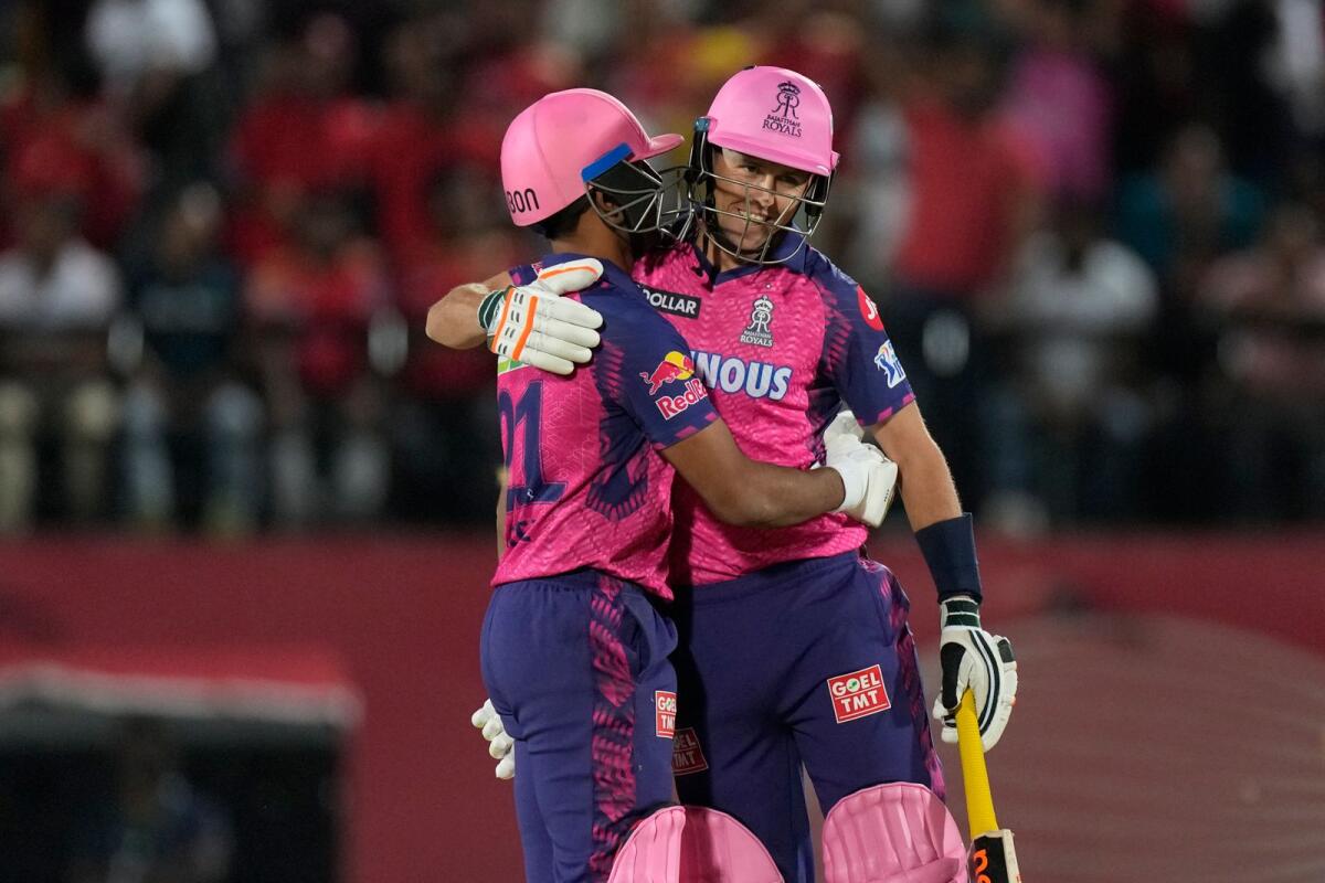 Rajasthan Royals' Dhruv Jurel (left) is hugged by teammate Trent Boult after he hit the match-winning six in the last over. — AP