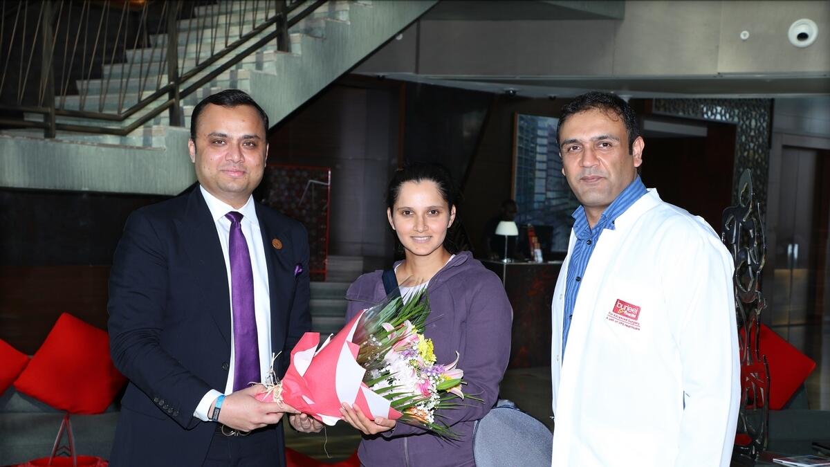 READY FOR ACTION: Dr Shajir Gaffar CEO of VPS Healthcare Dubai and Northern Emirates greets Sania Mirza along with Dr Faisal Hayat Khan.