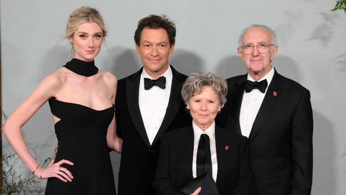 Elizabeth Debicki (L), Dominic West (2L), Imelda Staunton and Jonathan Pryce pose on the red carpet upon arrival to attend the World Premiere of 'The Crown (Season 5)' in London. — AFP