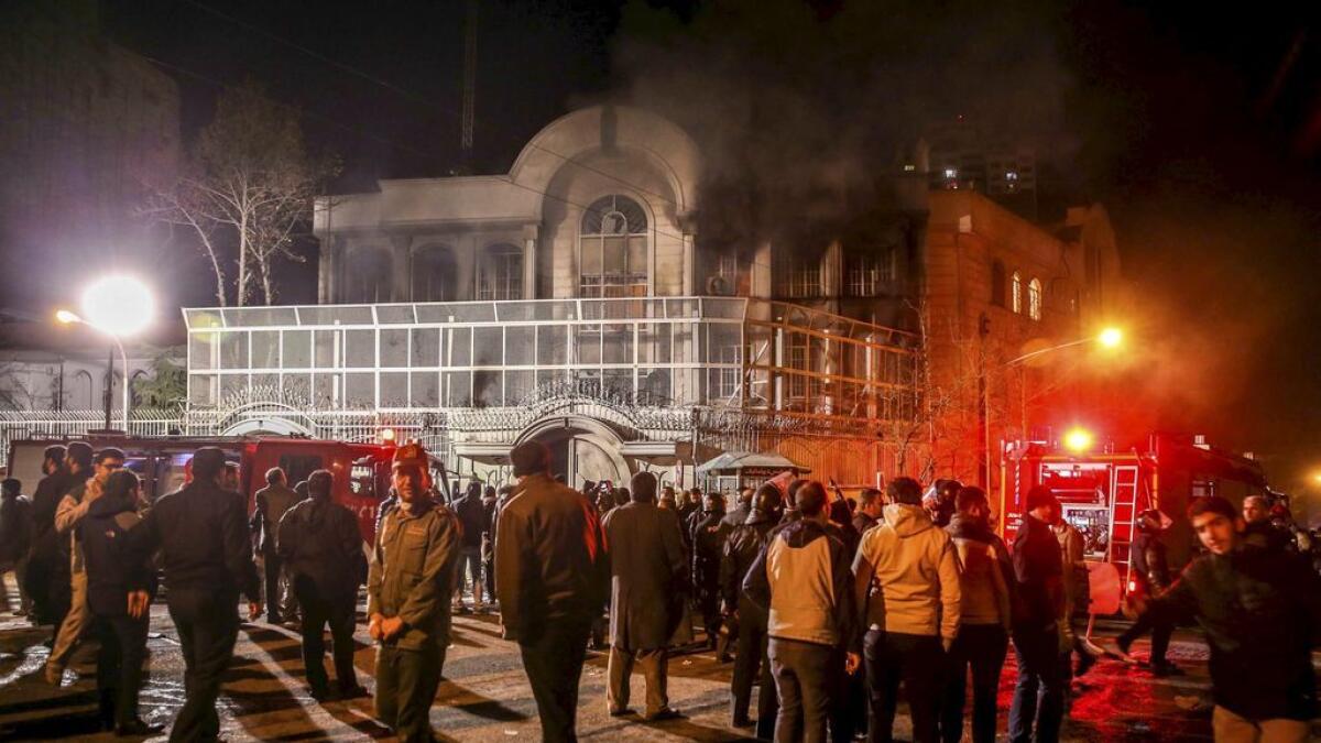 Smoke rises from Saudi Arabias embassy during a demonstration in Tehran.