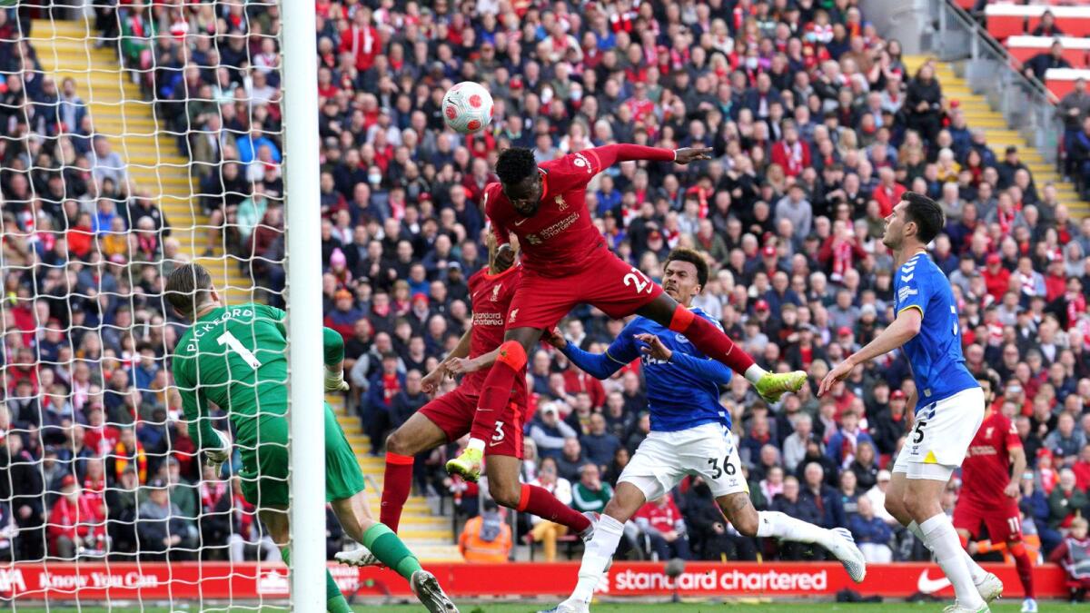Liverpool's Divock Origi (centre) scores his side's second goal during the Premier League match against Everton at Anfield on Sunday. (AP)