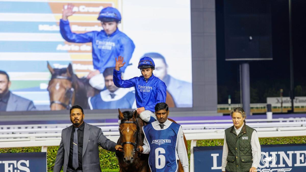 William Buick acknowledges the cheers at Meydan after Siskany won the Nad Al Sheba Trophy. - Photo by DRC