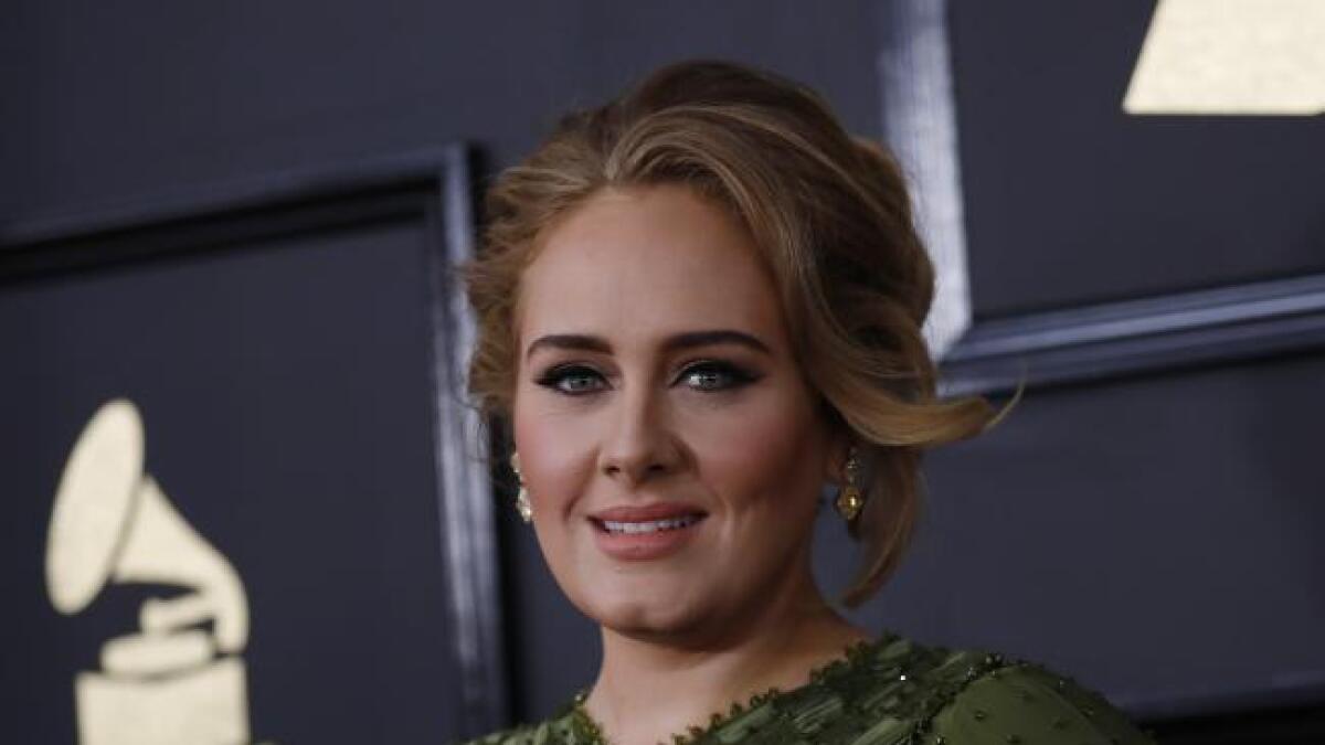 Adele sweeps Grammys but bows to Queen Beyoncé 
