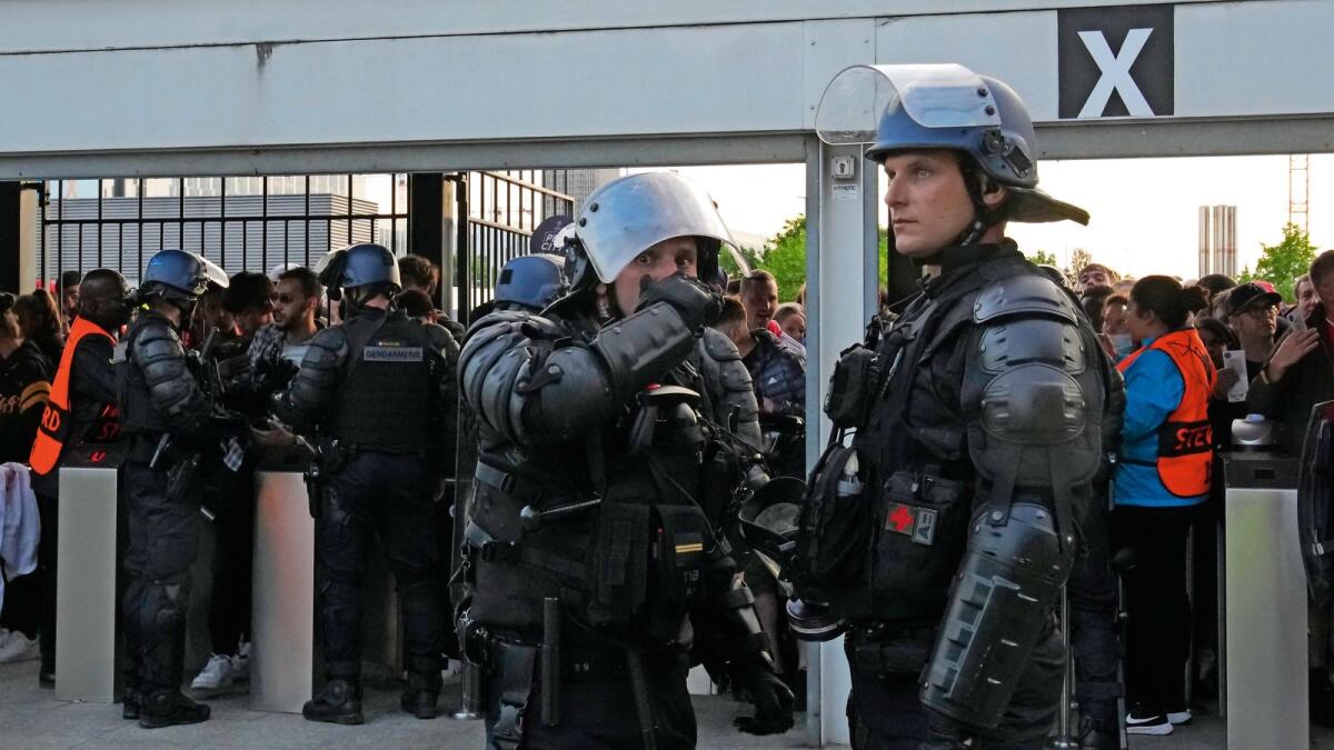 Keeping watch: Police stand guard inside the Stade de France prior to the Champions League final. — AP