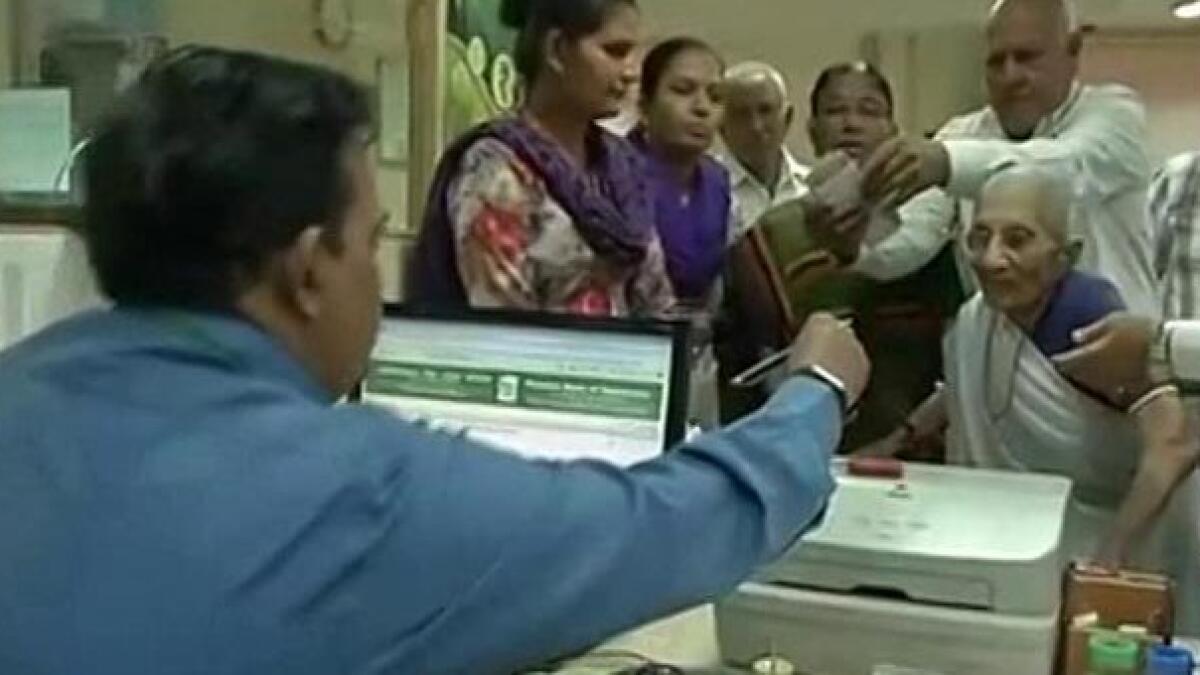 Narendra Modis mother stands in queue to exchange Rs 500, Rs 1000 notes