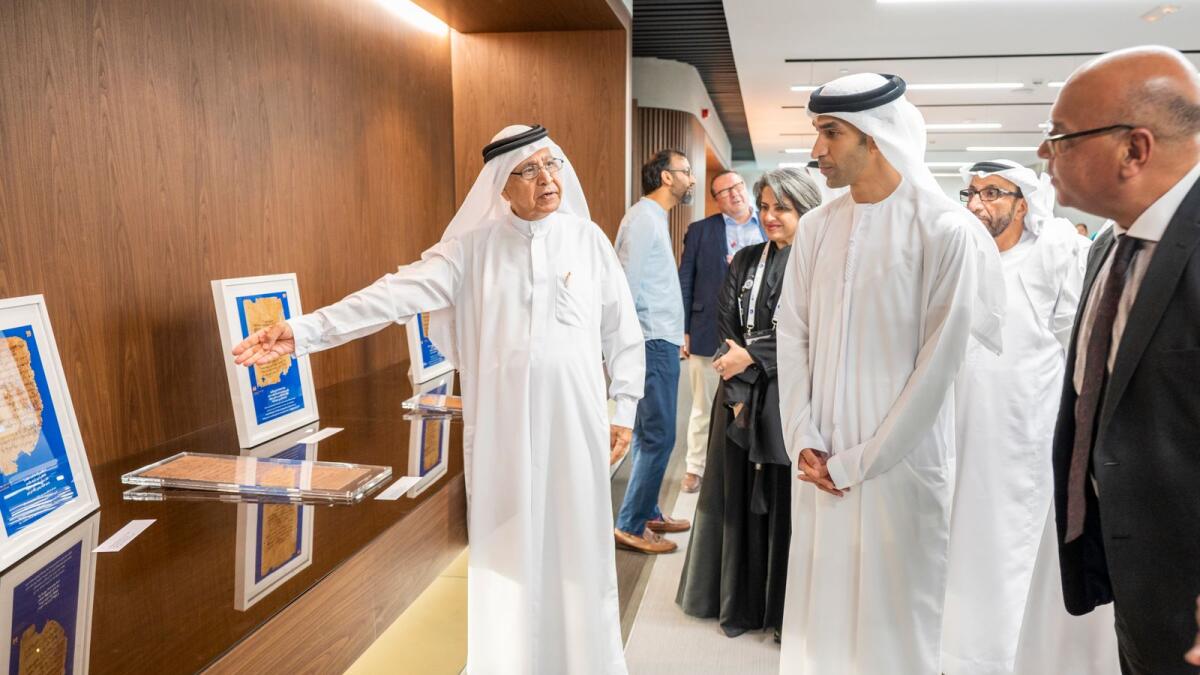Mirza Al Sayegh (left), Hind Al Mualla, chief of creativity, happiness and wellbeing,Knowledge &amp; Human Development Authority (second left), Thani bin Ahmed Al Zeyoudi, UAE Minister of State for Foreign Trade, and Dr AG Abubaker Head of College and Vice-Chancellor, Al Maktoum College of Higher Education (right), at the Hidden Literature exhibition at the British University. — Photo by Shihab