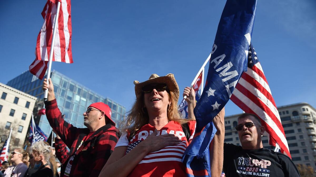 Supporters of US President Donald Trump rally in Washington, DC, on November 14, 2020. Supporters are backing Trump's claim that the November 3 election was fraudulent. / AFP / Olivier DOULIERY