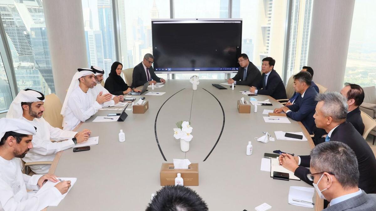 Dr Thani bin Ahmed Al Zeyoudi, Minister of State for Foreign Trade, chairing a meeting with Wang Guihai, chairman of the Chinese Business Council in Dubai, and several representatives of several Chinese companies. — Supplied photo