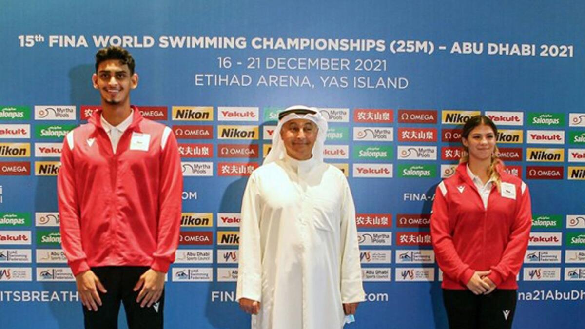 Youssef Al Matrooshi and Layla Al Khatib with Husain Al Musallam, the newly elected Fina president. (Supplied photo)