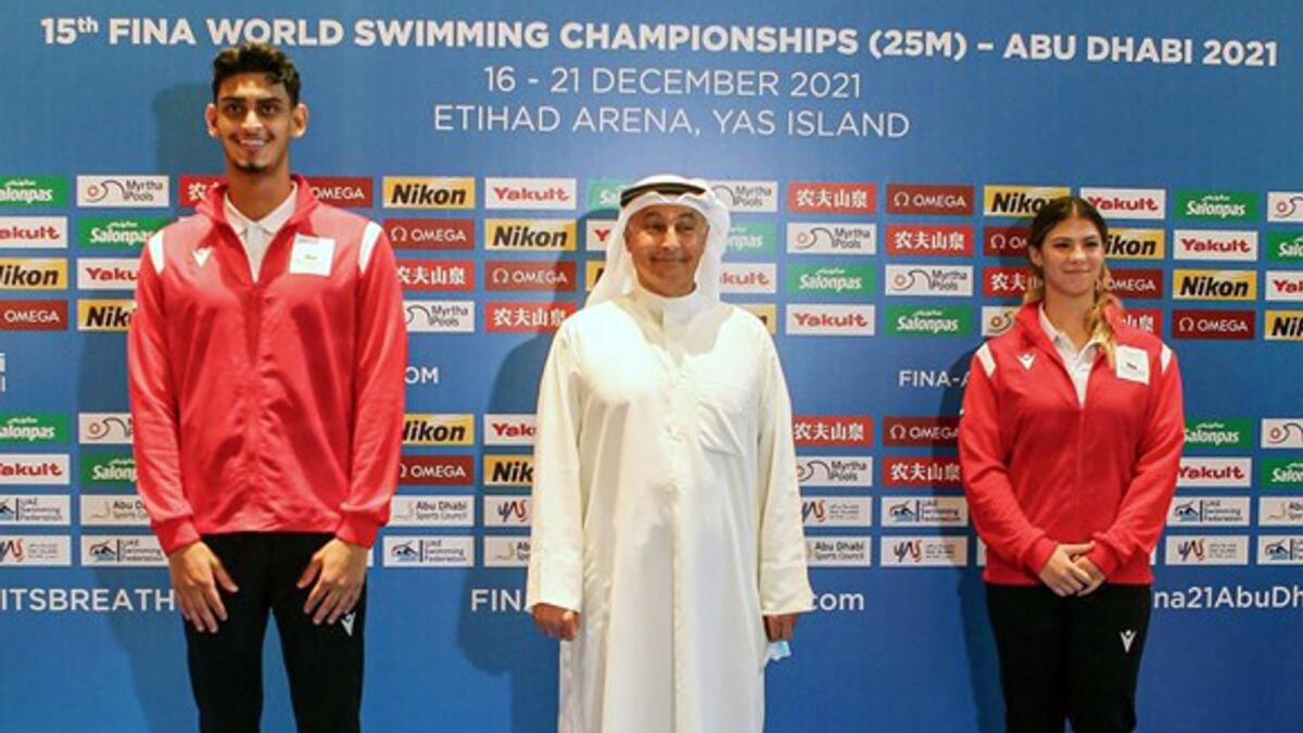 Youssef Al Matrooshi and Layla Al Khatib with Husain Al Musallam, the newly elected Fina president. (Supplied photo)