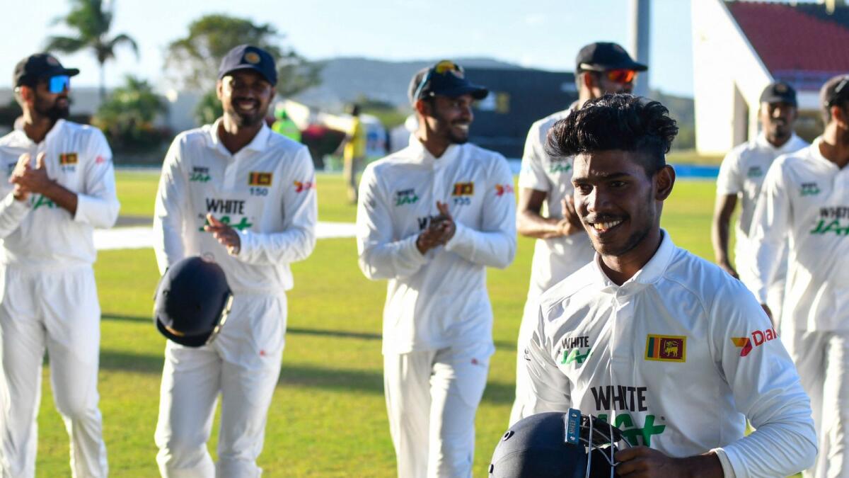Pathum Nissanka (right) of Sri Lanka led his teammates off the field at the end of day 4 of the 1st Test against West Indies in North Sound, Antigua and Barbuda. — AP