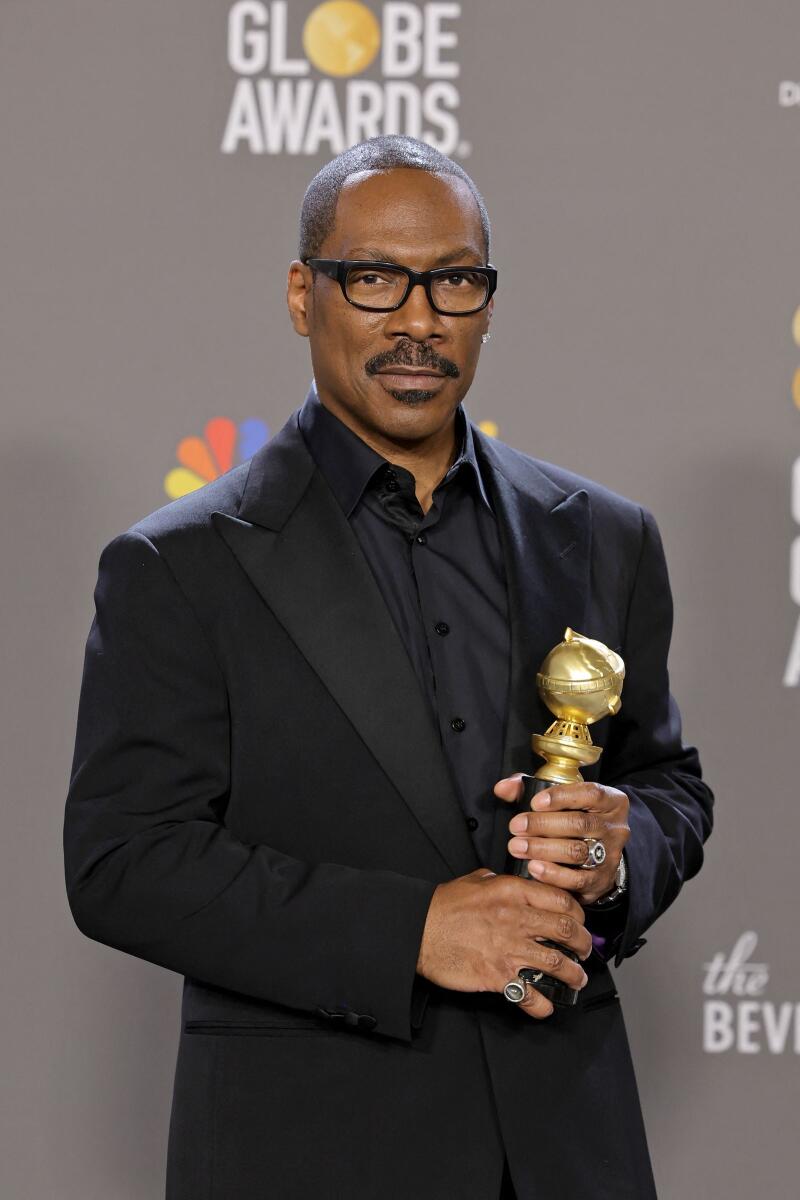 Eddie Murphy poses with the Cecil B. Demille Award in the press room during the 80th Annual Golden Globe Awards