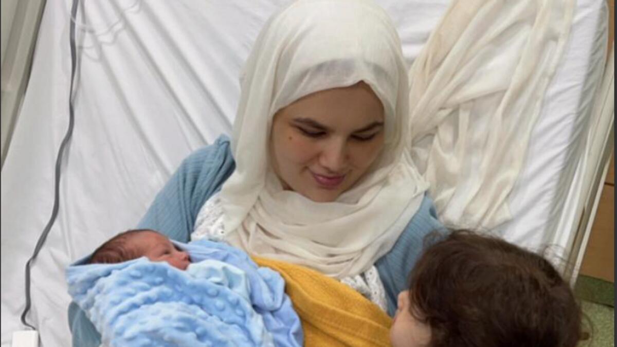 Fatima Ali with her newborn and elder child at Zulekha Hospital Sharjah. — Supplied photo