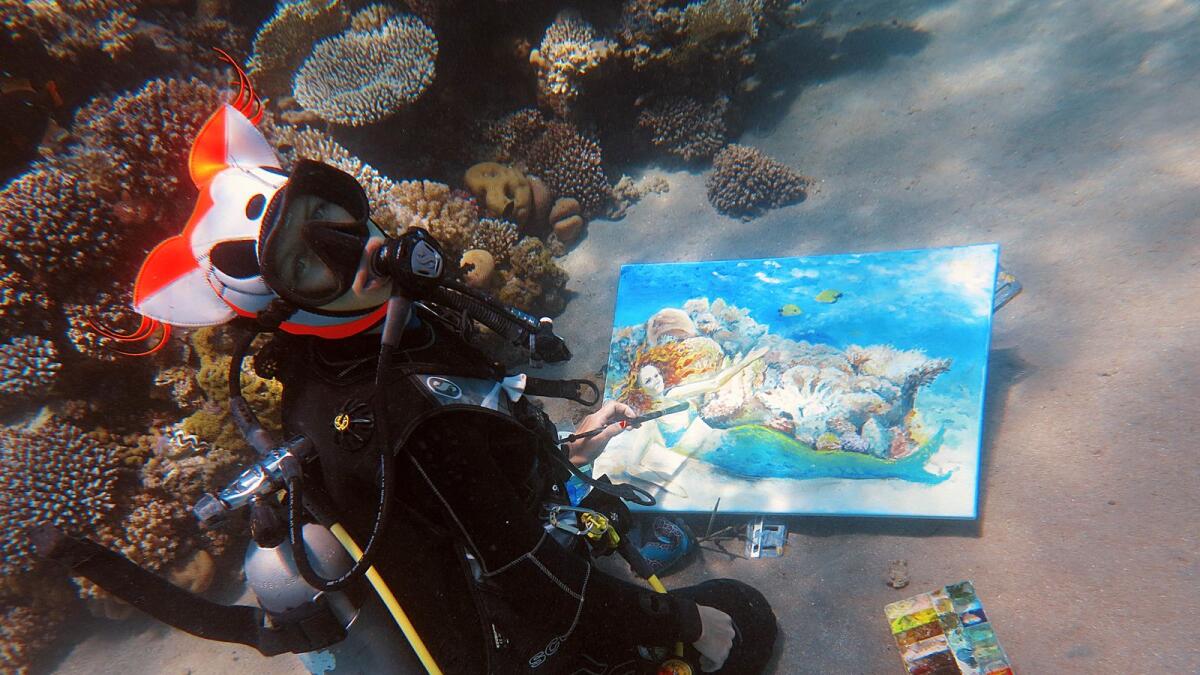 Olga Belka's perfect painting spot is is usually an area on the seabed next to the corals.