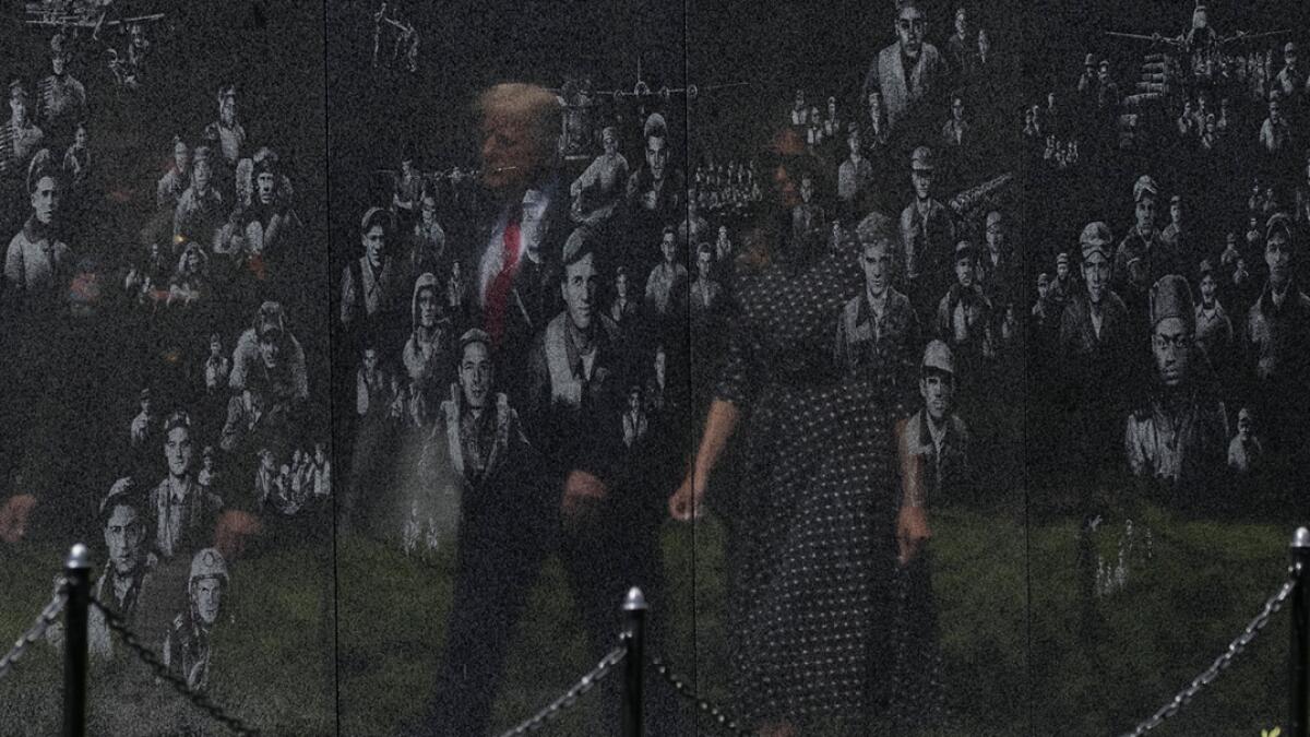 US President Donald Trump, accompanied by first lady Melania Trump, arrives to place a wreath at the Korean War Veterans Memorial in Washington. Photo: AP