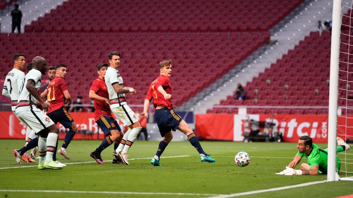 Portugal's goalkeeper Rui Patricio makes a save during the international friendly  match against Spain. — AP