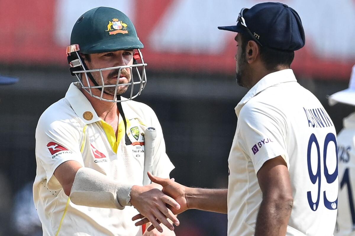 Australia's Travis Head (left) greets India's Ravichandran Ashwin after the end of the third Test. — AFP