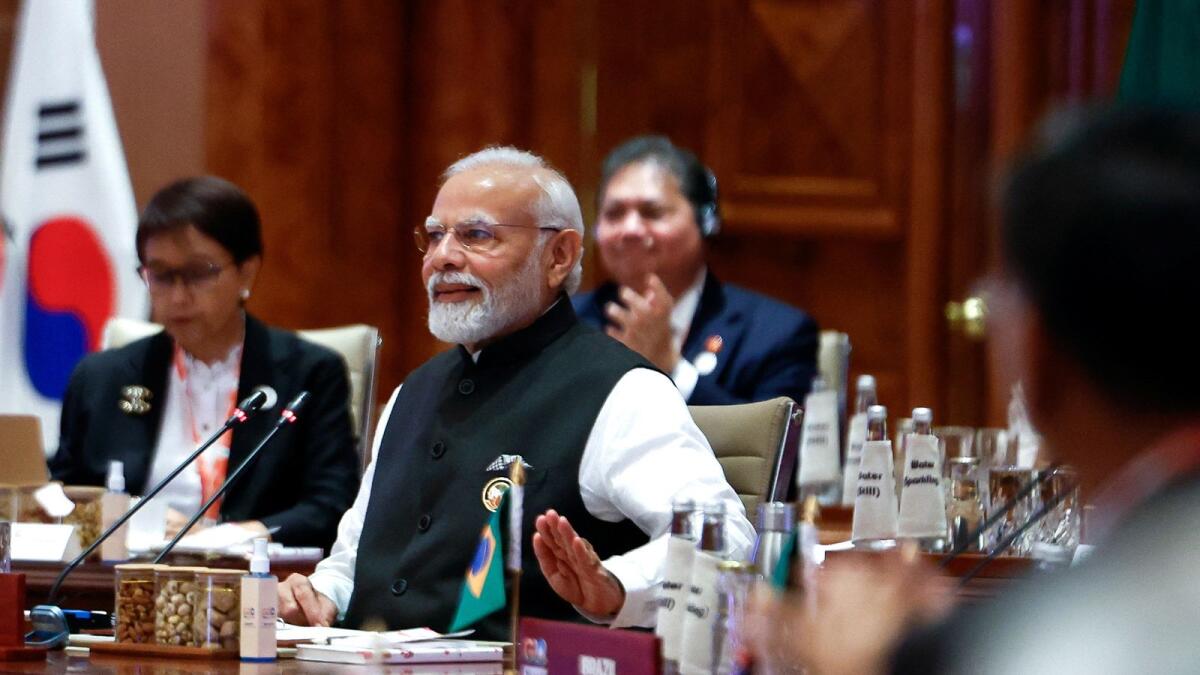 Indian Prime Minister Narendra Modi claps the table as he announces the consensus on the G20 Leaders Summit Declaration while attending 'Session II: One Family' at the G20 summit in New Delhi. — Reuters