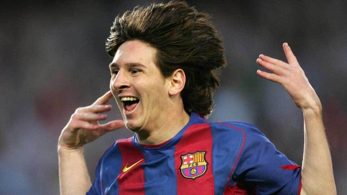 Messi celebrates his first goal for Barcelona after scoring against Albacete in a La Liga clash in May 2005