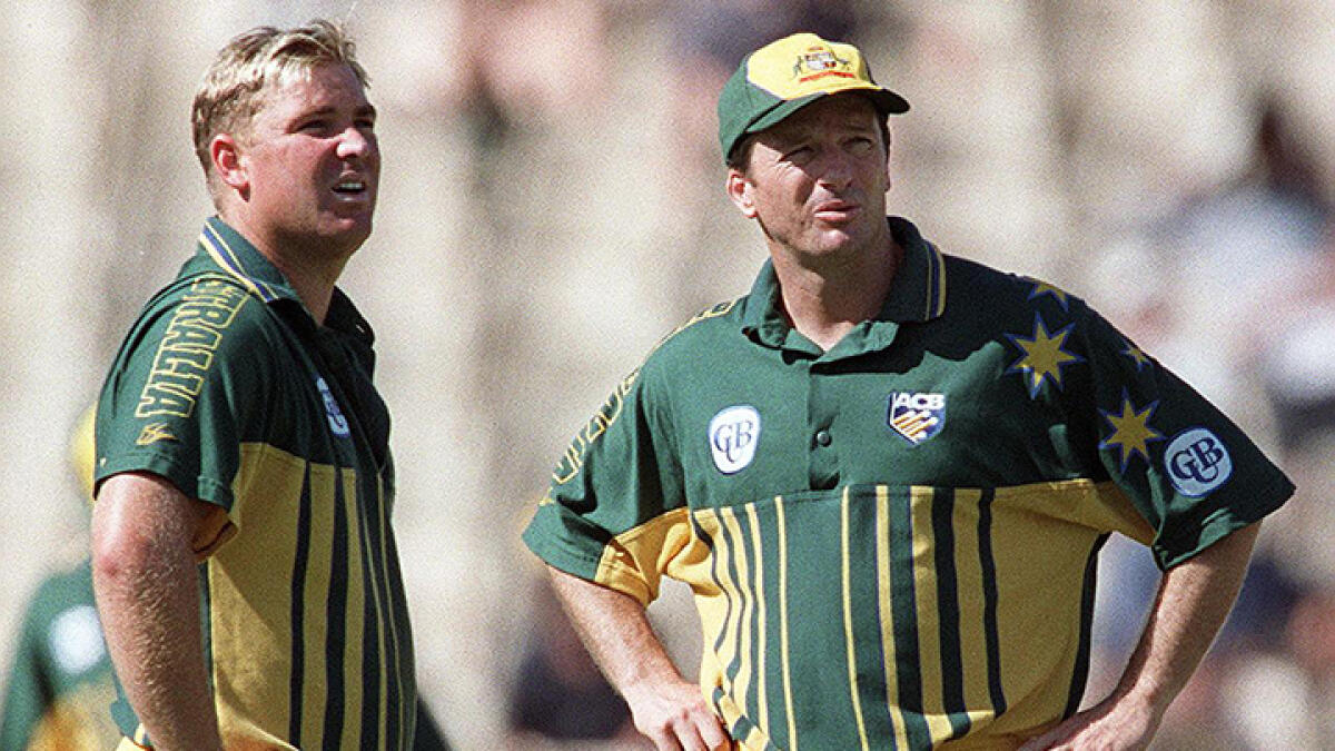 Shane Warne and Steve Waugh (right) share a frayed relationship ever since Warne was dropped during a Test tour of the West Indies in 1999. -- AFP file