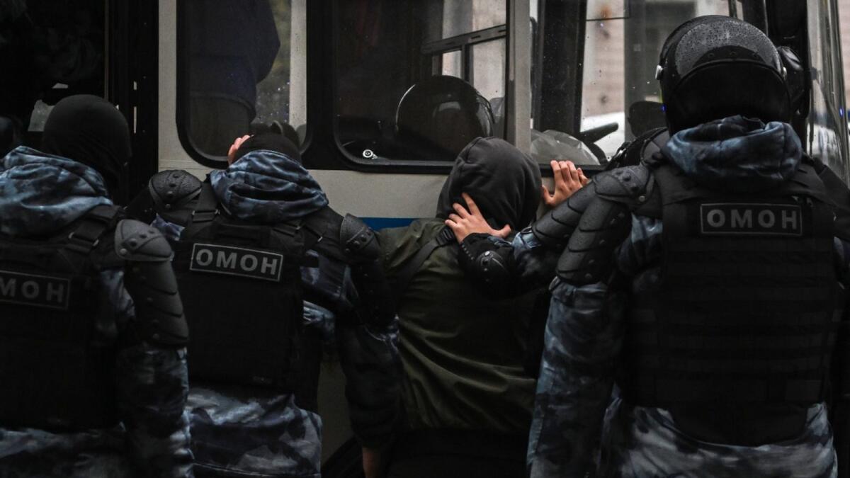 Police officers detain protestor in Moscow. Photo: AFP
