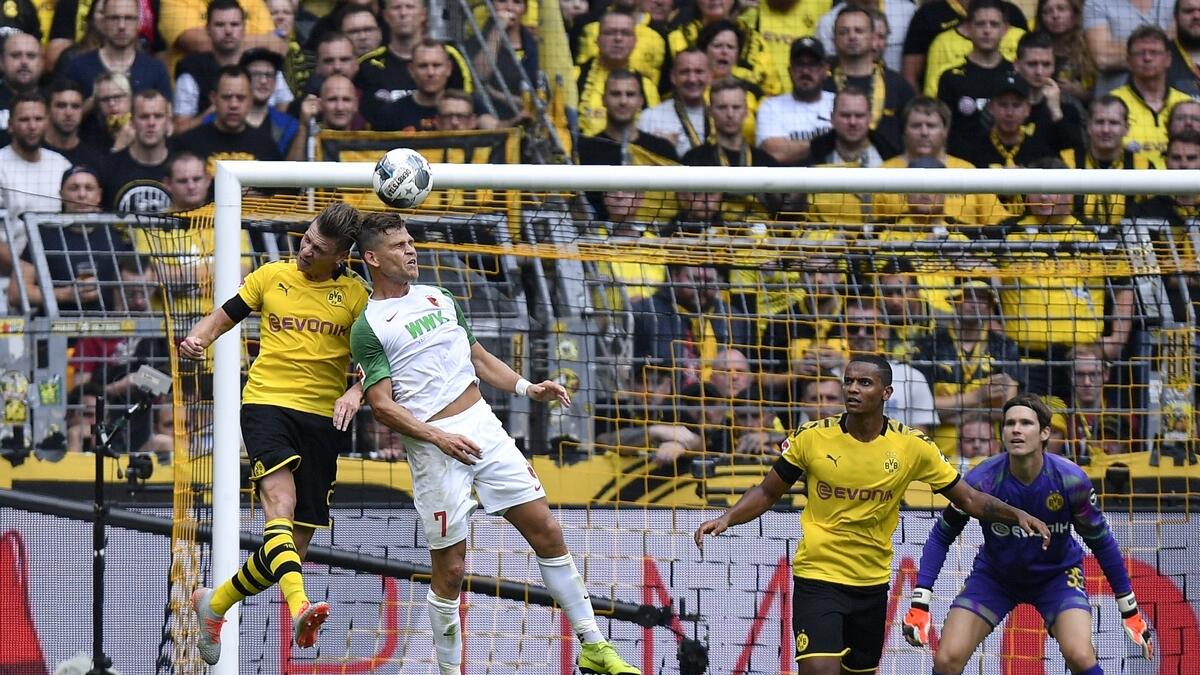Dortmund launch title charge with Augsburg rout
