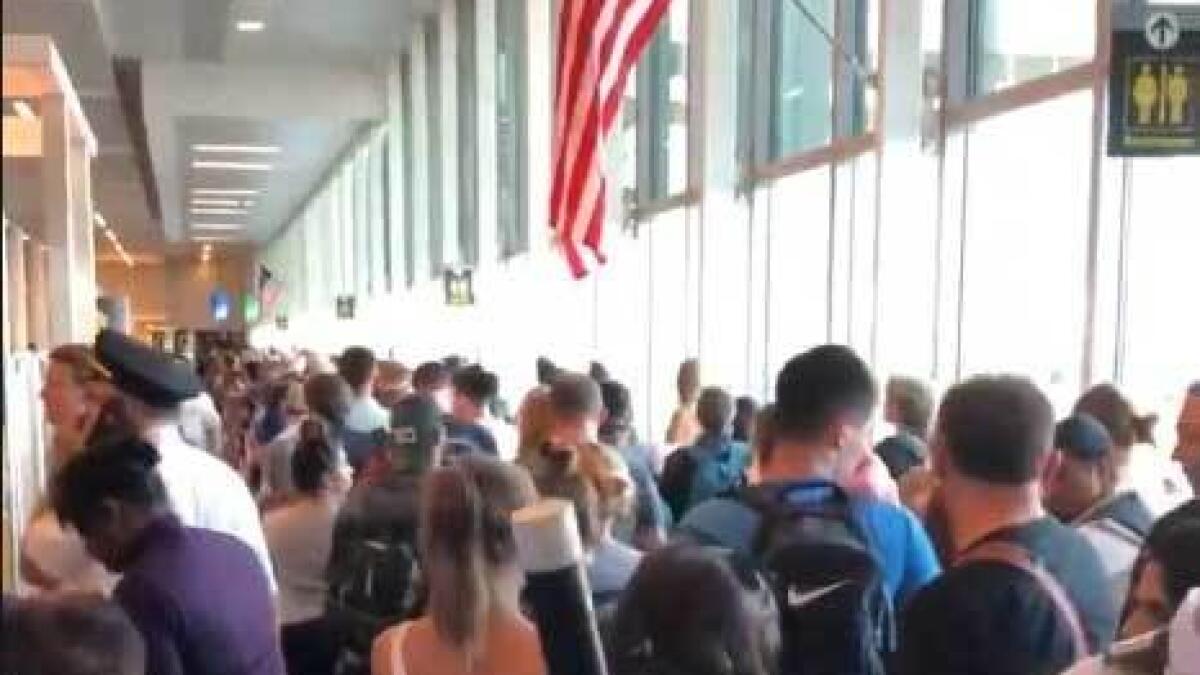 Travellers, delays, airports, Los Angeles, Seattle, Philadelphia, San Francisco, Houston, Chicago, New York’s John F Kennedy Airport, system outage, 