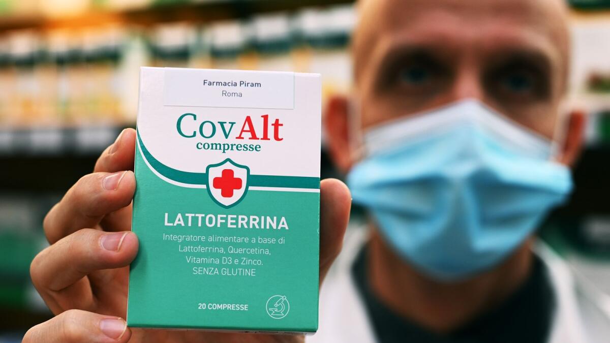 A pharmacist shows a lactoferrin alimentar integrator in Rome on October 30, 2020.