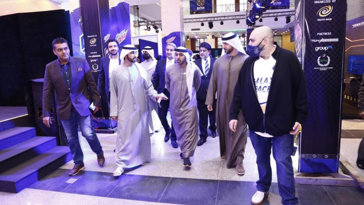 Sheikh Ahmed Dalmook Al Maktoum and Fakhr Alam touring the Pakistan's biggest e-sports festival Gamers Galaxy after inauguration in Islamabad on Saturday. -- Supplied photo 