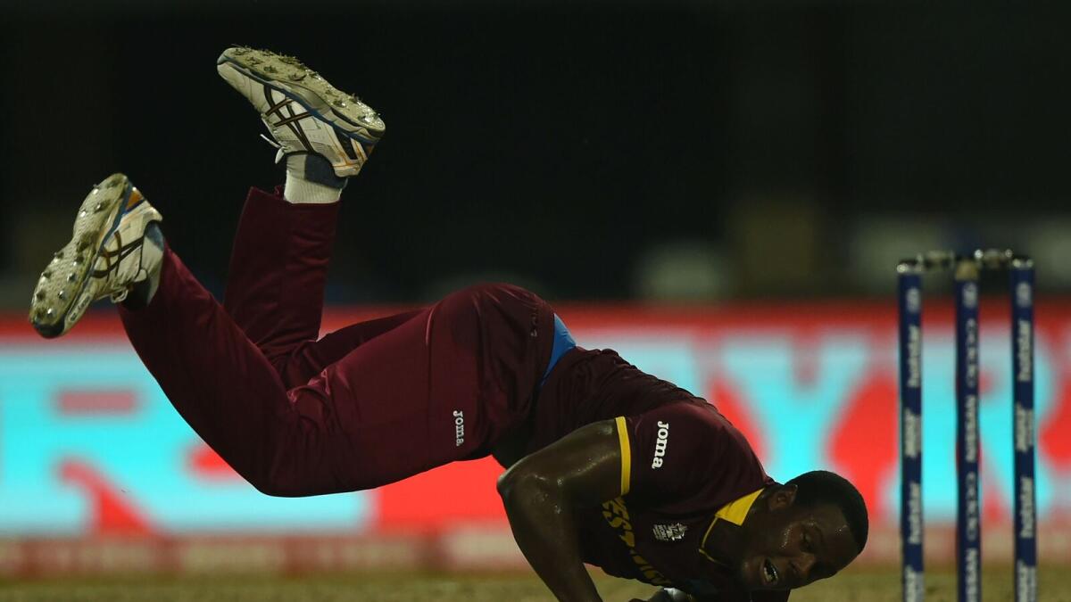 West Indies's Carlos Brathwaite fields a ball during the World T20 cricket tournament final match between England and West Indies at The Eden Gardens Cricket Stadium in Kolkata on April 3, 2016.
