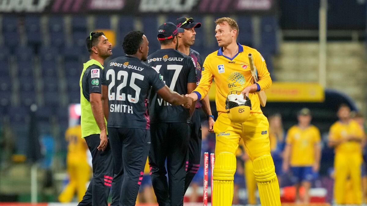 Danny Briggs (right) is congratulated by Deccan Gladiators' players after the match. (Abu Dhabi T10)