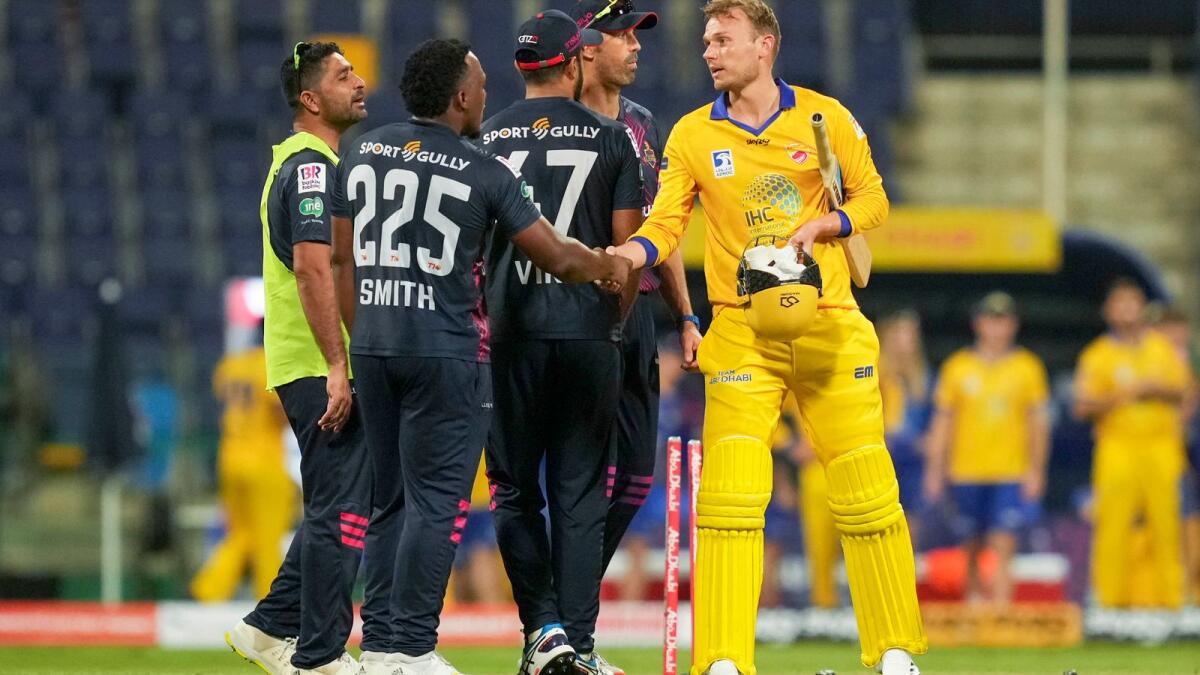 Danny Briggs (right) is congratulated by Deccan Gladiators' players after the match. (Abu Dhabi T10)
