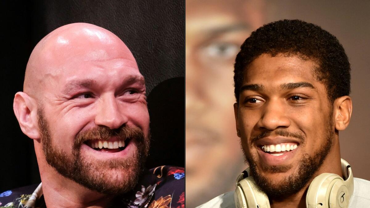 British boxers Tyson Fury and Anthony Joshua. (AFP)