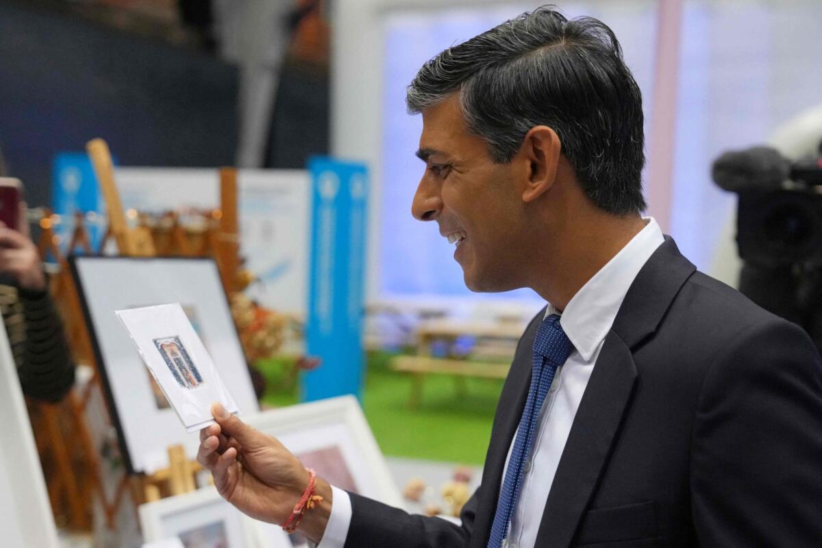 Britain's Prime Minister Rishi Sunak tours the Exhibitor's Hall on day 3 of the Conservative Party Conference in Manchester, northern England, on October 3, 2023.– AFP