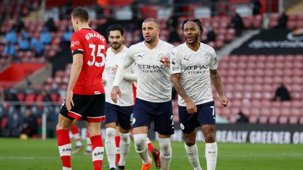 Manchester City's Raheem Sterling (right) celebrates after scoring a goal against Southampton during the English Premier League match. — AP