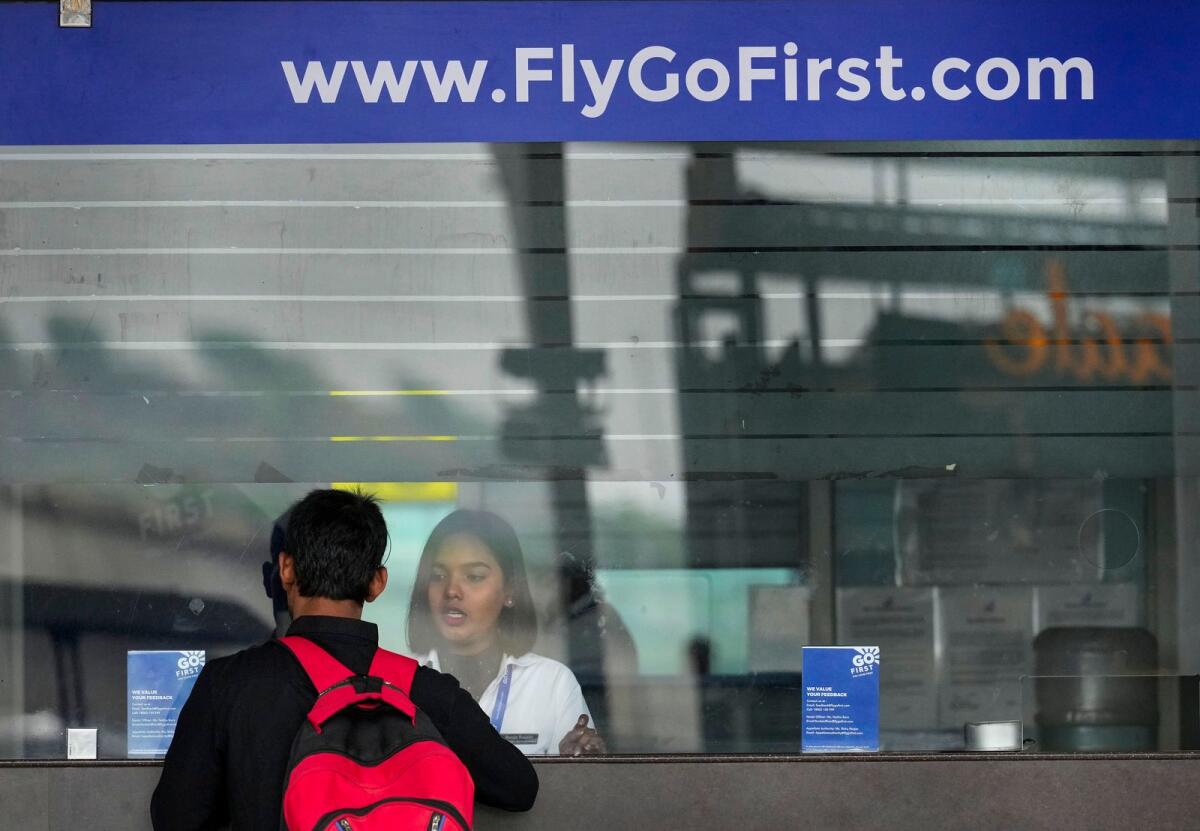 A passenger at a ticketing office of Go First airlines at Kamaraj Domestic Airport in Chennai on May 3, 2023. — PTI