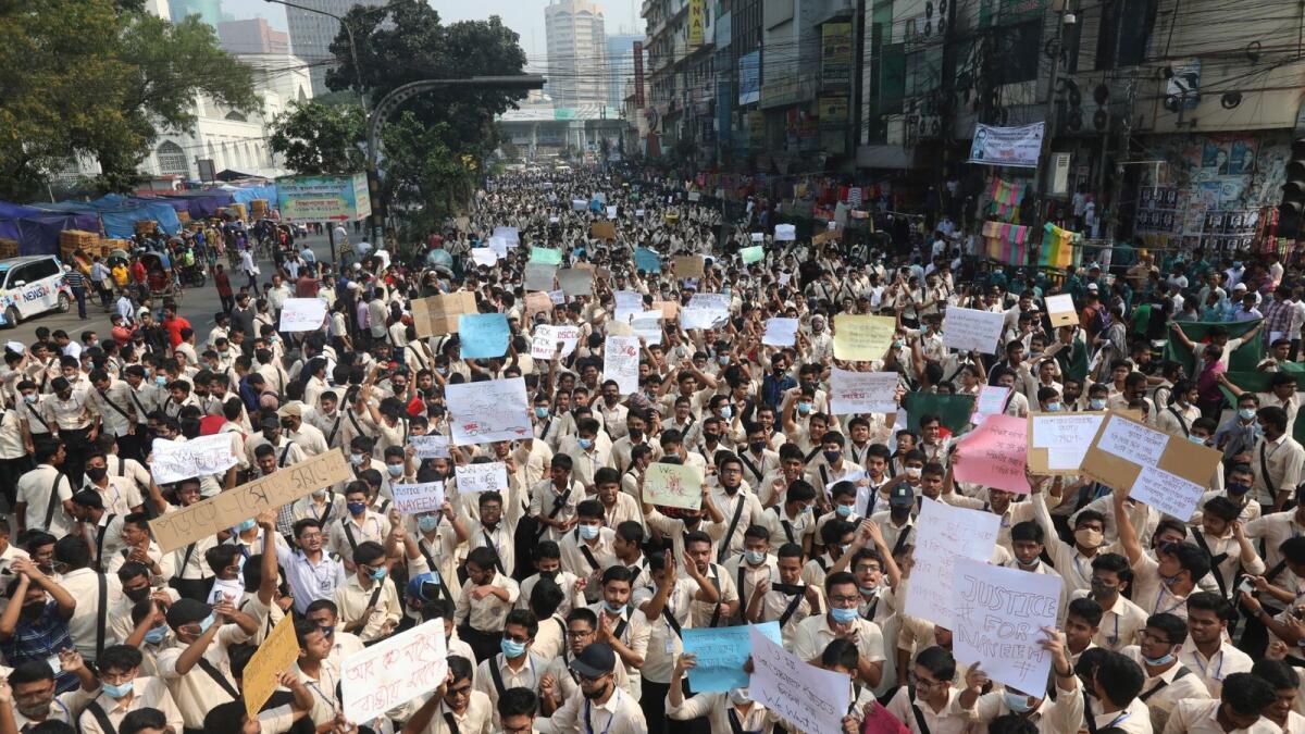 Students block a road during a protest to demand road safety in Dhaka. – AFP