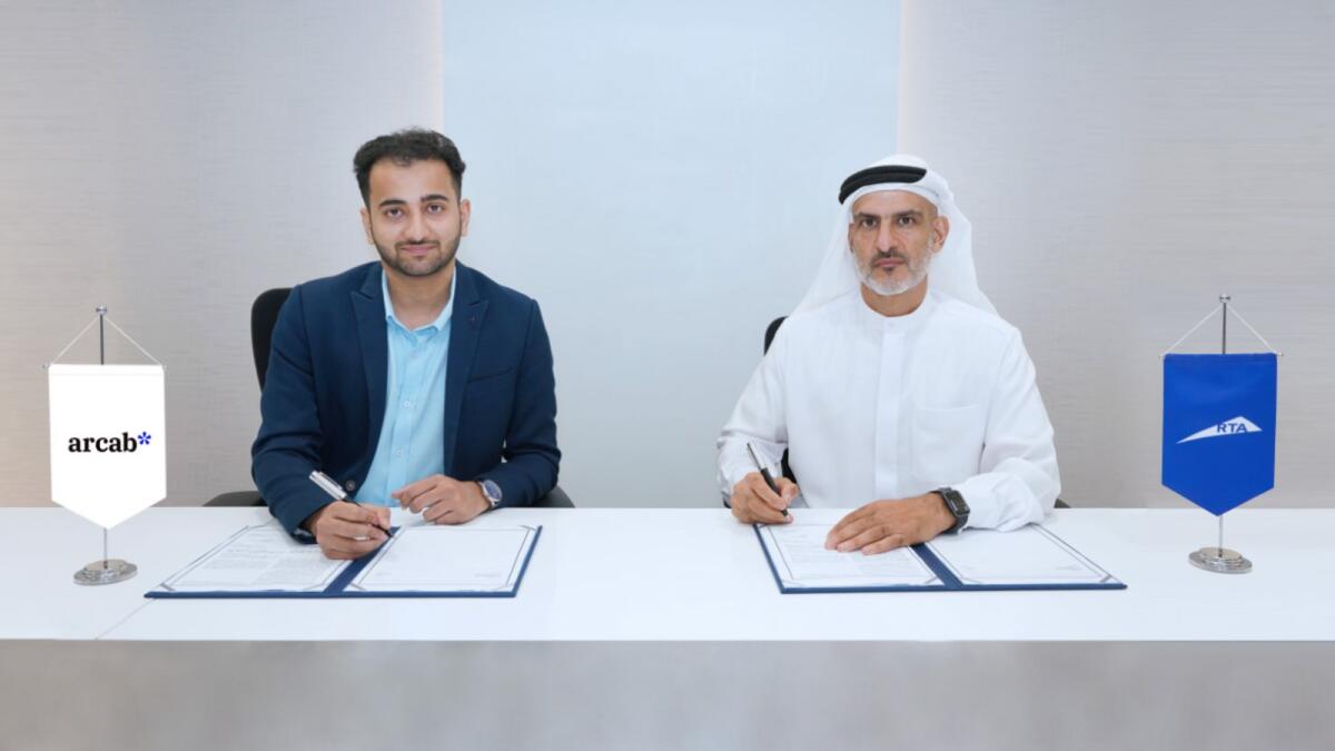 Ahmed Hashem Bahrozyan and Bilal Shabandri sign an agreement in Dubai. — Supplied photo