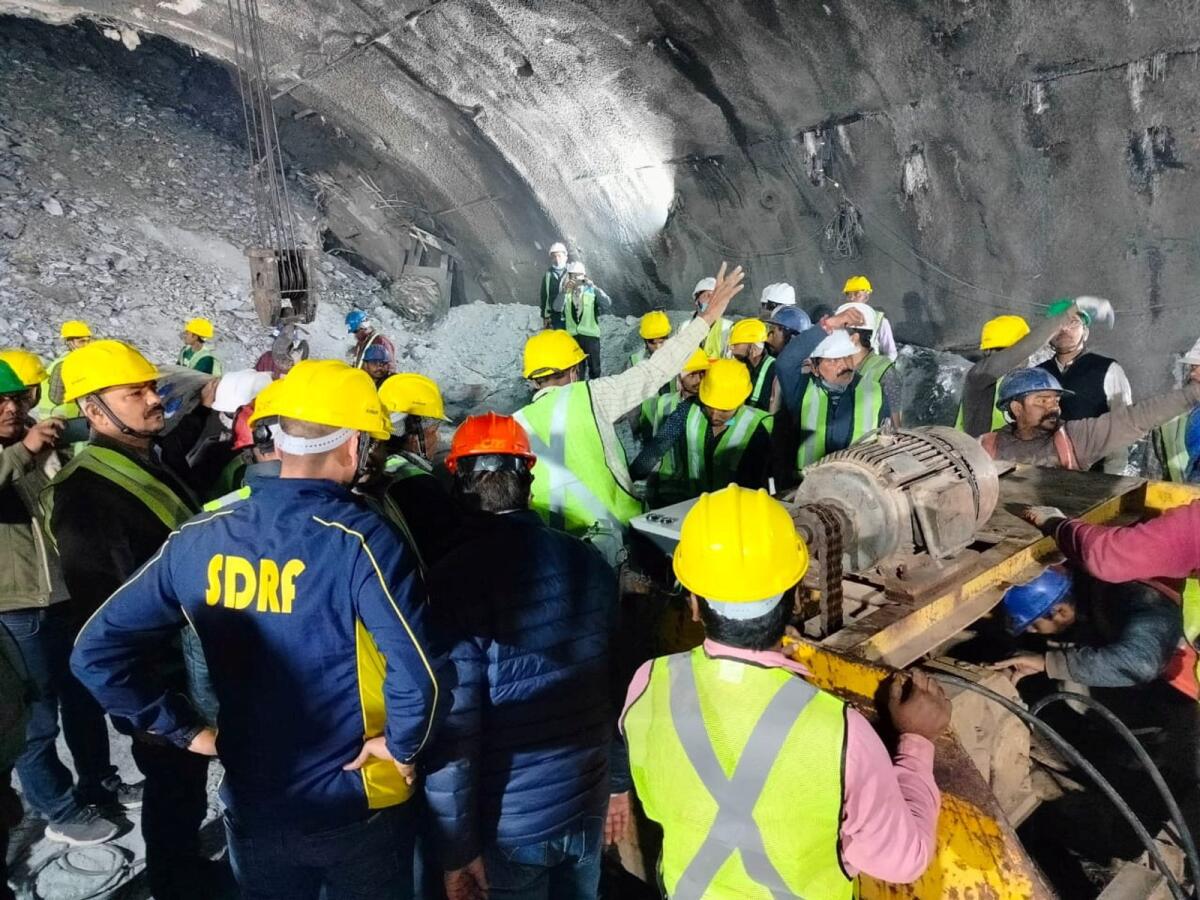 Members of rescue teams prepare to conduct a rescue operation after a portion of an under-construction tunnel collapsed. Photo: Reuters