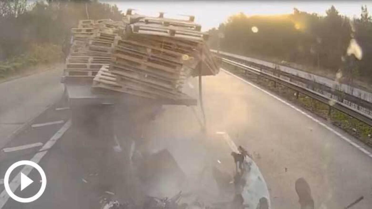 GRAPHIC: Motorists legs left hanging in horrific lorry crash