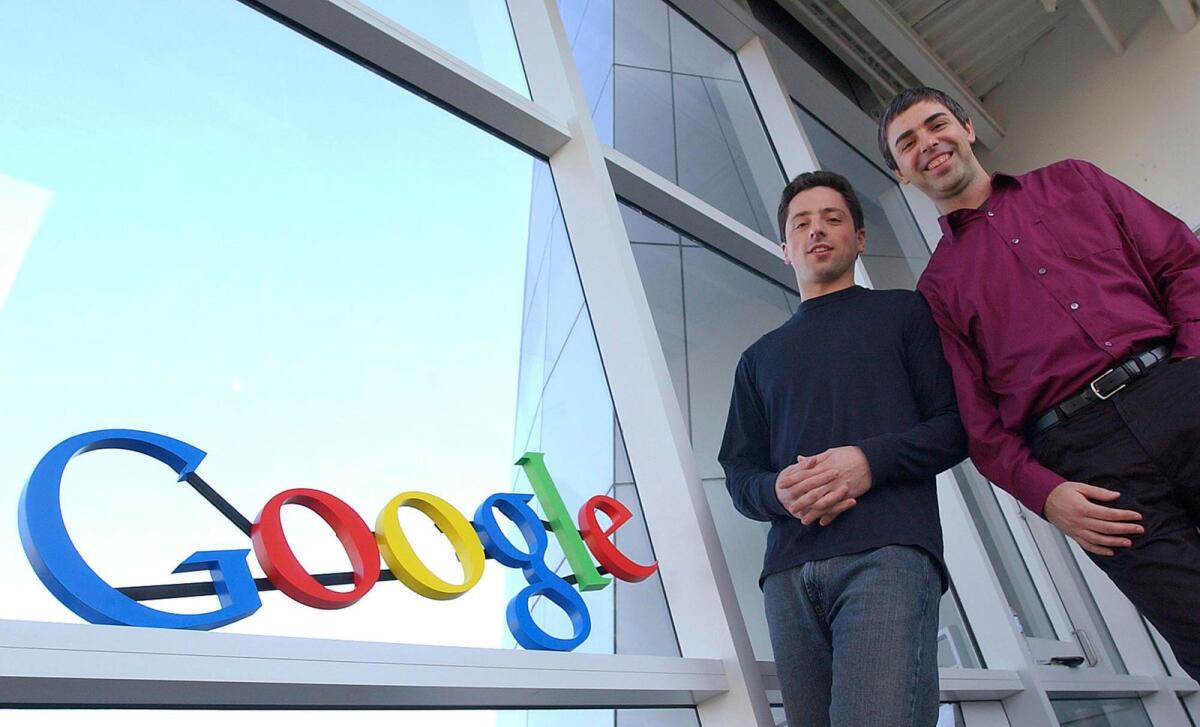 Google co-founders Sergey Brin, left, and Larry Page at company headquarters on January15, 2004, in Mountain View, California. — AP