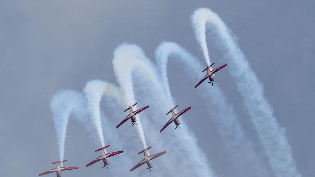 The Indonesian Air Force's Jupiter aerobatic team flying KT-1 aircraft perform during a preview of the Singapore Airshow in Singapore. — AFP