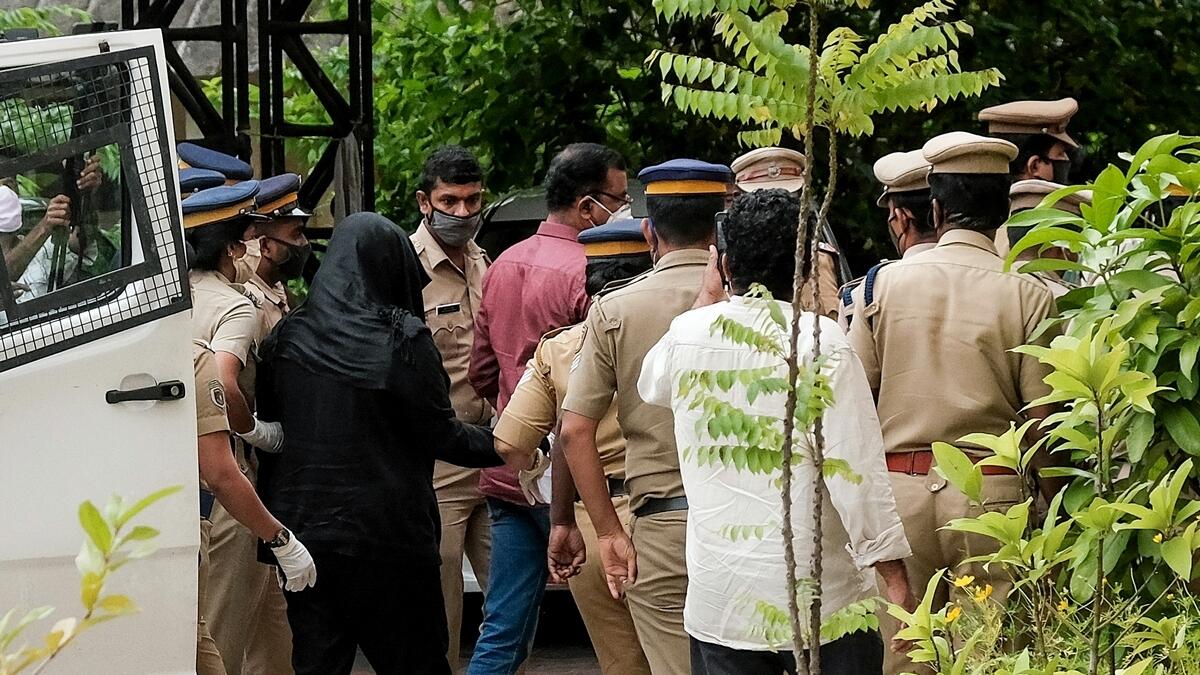 Accused in Kerala gold smuggling case, Swapna Suresh, being taken by police after a hearing at a special court, in Kochi, Monday.