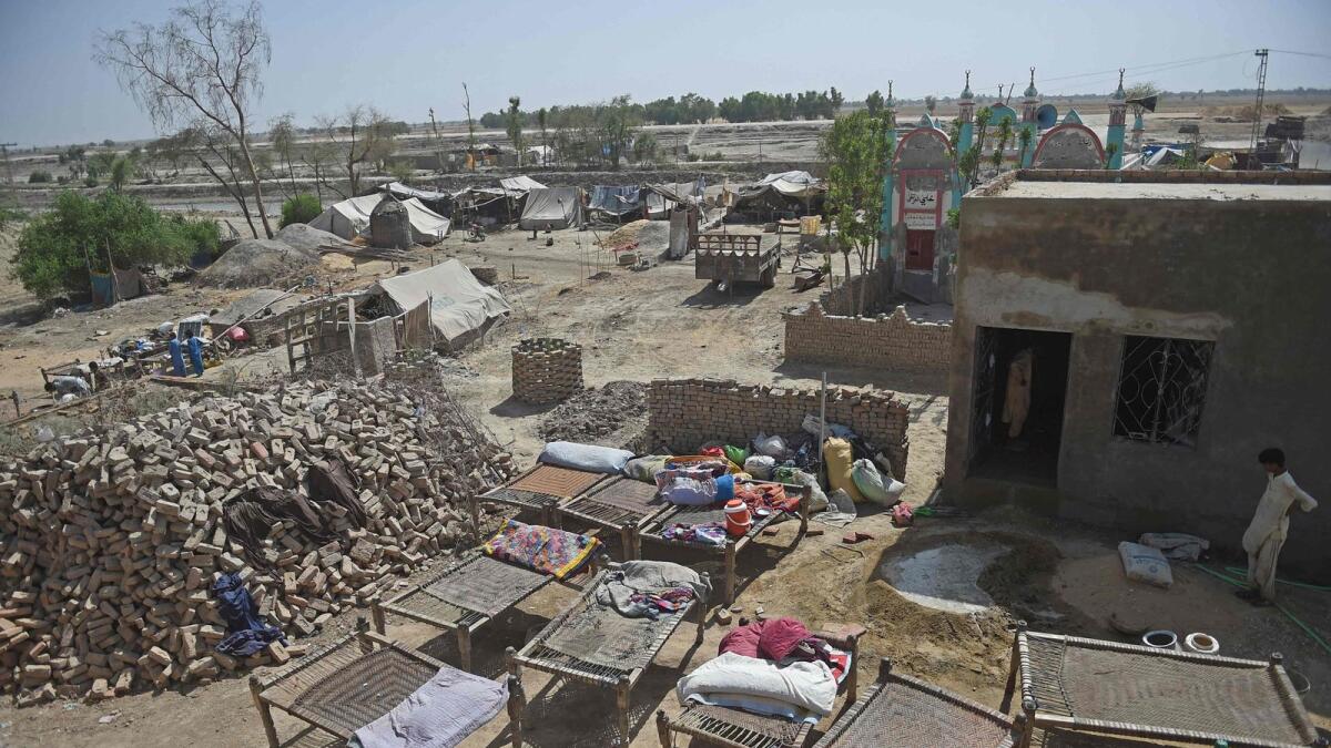In this photograph taken on May 9, 2023, a flood-affected village lies in ruins in Dadu district of Pakistan. — AFP
