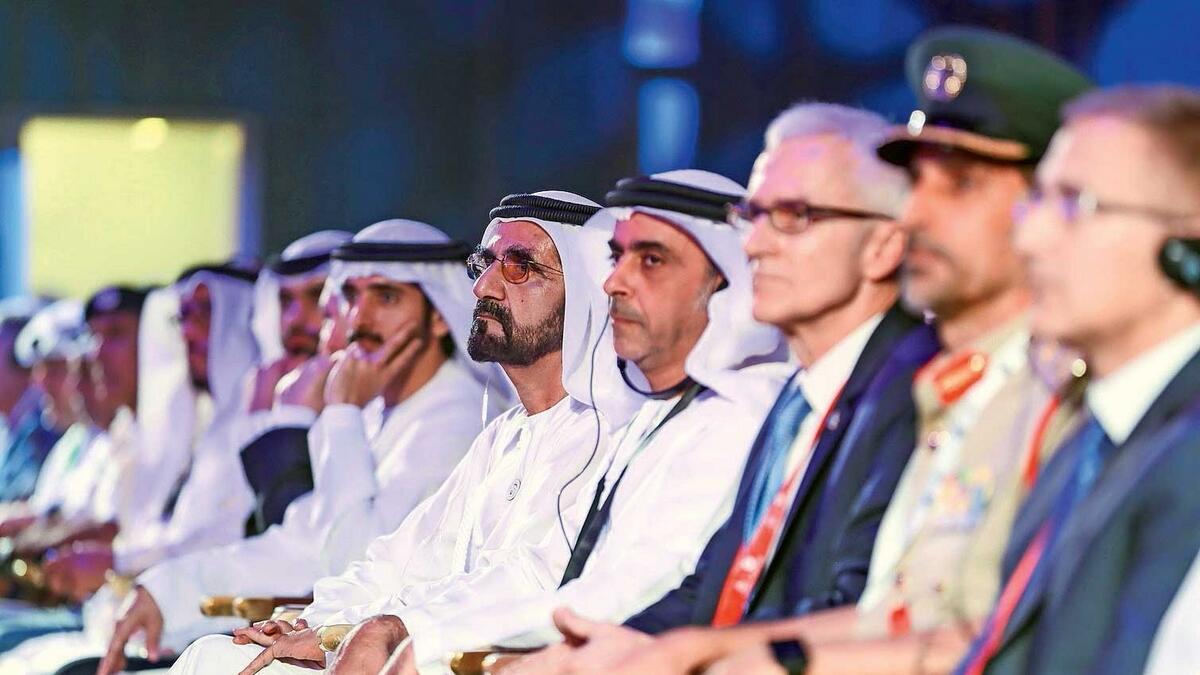 Sheikh Mohammed, Lt-General Sheikh Saif and other officials at the 87th Interpol General Assembly in Dubai on Sunday.—Wam