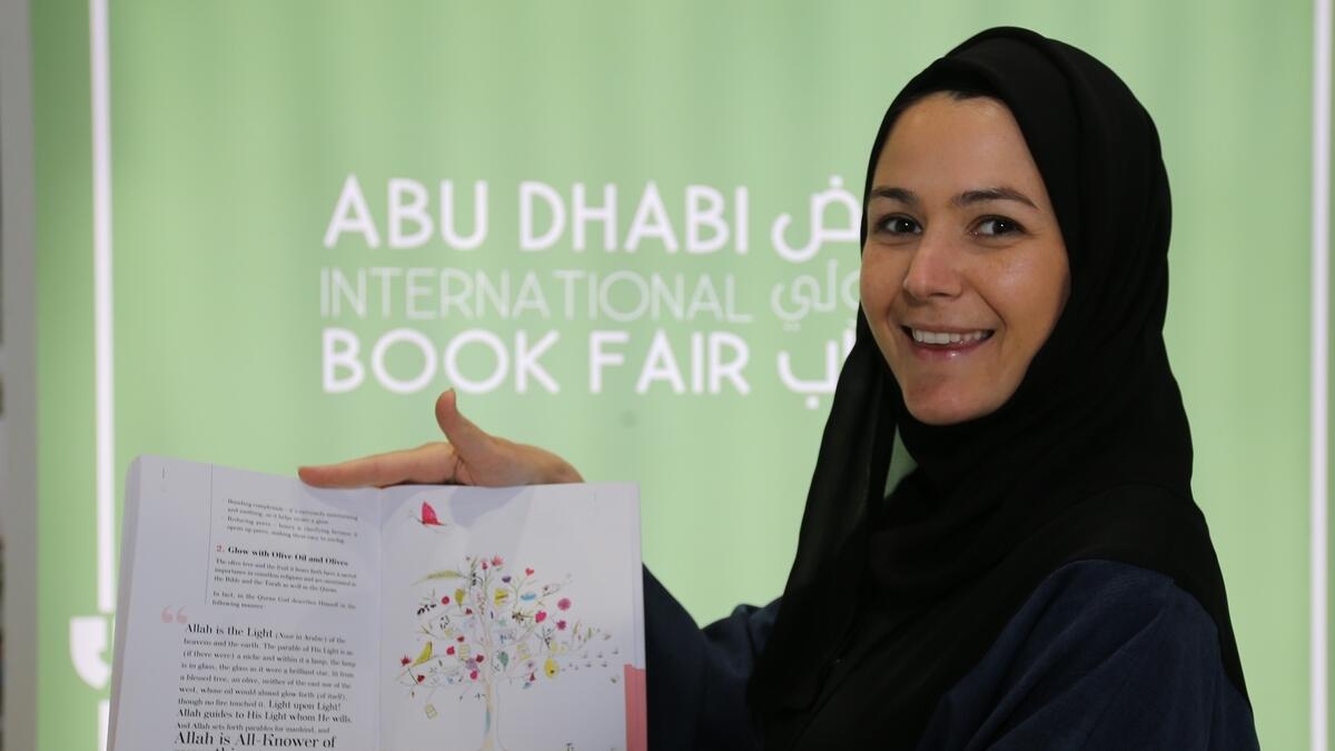 Mathilde Loujayne with her book ‘Big Little Steps’ at the Abu Dhabi Book Fair.-Photo by Ryan Lim/ Khaleej Times