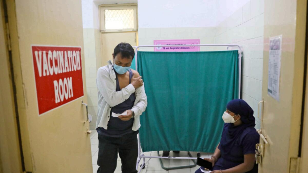 A man comes out after receiving Covid-19 vaccine at a government hospital in New Delhi. — AP file